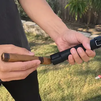 Lighting a cigar with the TacFlame jet flame in a garden